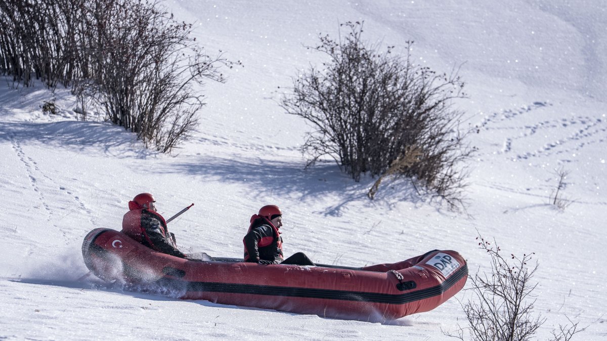 Participants enjoy snow rafting during an outdoor winter event in Erzurum, eastern Türkiye, Jan. 25, 2026. (AA Photo)