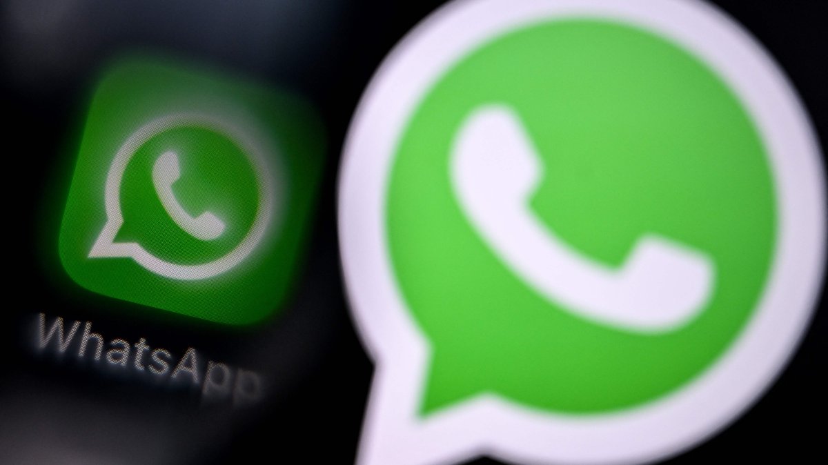 This illustration photograph shows the logo of U.S. instant messaging software WhatsApp displayed on a smartphone's screen, in Frankfurt am Main, western Germany, Dec.1, 2025. (AFP Photo) 