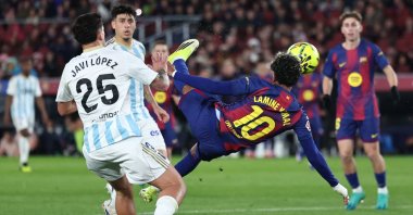 Barcelona's Lamine Yamal (R) scores his team's third goal during the Spanish league football match against Real Oviedo at Camp Nou Stadium, Barcelona, Spain, Jan. 25, 2026. (AFP Photo)