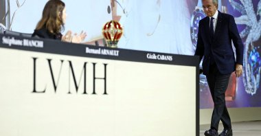 Bernard Arnault, chair and CEO of LVMH, is applauded by Cecile Cabanis, CFO of the LVMH Group, after his speech during the annual shareholders meeting of LVMH Moet Hennessy Louis Vuitton, Paris, France, April 17, 2025. (Reuters Photo)