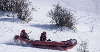 Participants enjoy snow rafting during an outdoor winter event in Erzurum, eastern Türkiye, Jan. 25, 2026. (AA Photo)
