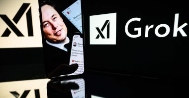 This photograph shows screens displaying the logo of Grok and Elon Musk, Toulouse, France, Jan. 13, 2025. (AFP Photo)