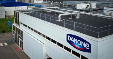 An aerial view shows a building of the Danone industry, with the company logo on the facade, in Ferrieres-en-Bray, France, March 29, 2023. (AFP Photo)