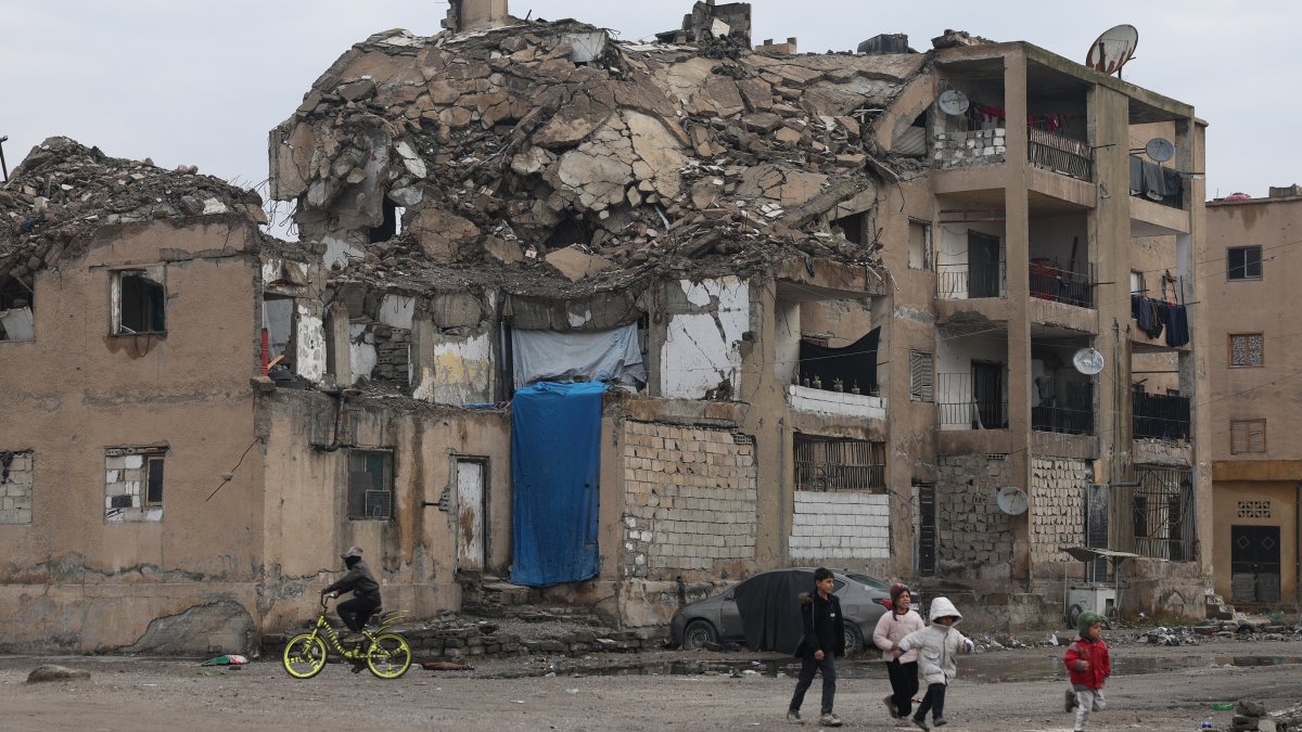 Children play in a damaged residential building, Raqqa, Syria, Jan. 24, 2026. (AP Photo)