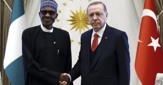 President Recep Tayyip Erdoğan and Nigeria's President Muhammadu Buhari shake hands before a meeting at the presidential palace, Ankara, Türkiye, Oct. 19, 2017. (AP Photo)