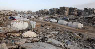 A tent camp, where displaced Palestinians take shelter, stands amidst the rubble of buildings destroyed in Israeli strikes during the war, Gaza City, Palestine, Jan. 27, 2026. (Reuters Photo)