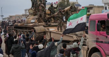 People celebrate the entry of Syrian army forces into the Deir Hafer area after the withdrawal of PKK/YPG terrorists in Deir Hafer, eastern Aleppo countryside, Syria, Jan. 17, 2026. (EPA Photo)