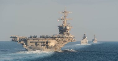 The USS Abraham Lincoln aircraft carrier transits the Strait of Hormuz, Nov. 19, 2019. (AFP File Photo)