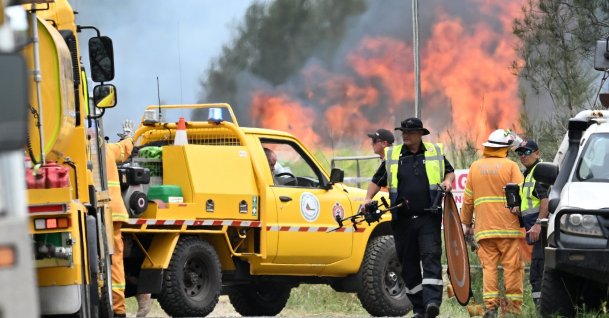 Firefighters and emergency personnel fight a bushfire at the scene of a light plane crash at Jacobs Well, Gold Coast, Australia, Jan. 27, 2026. (EPA Photo)