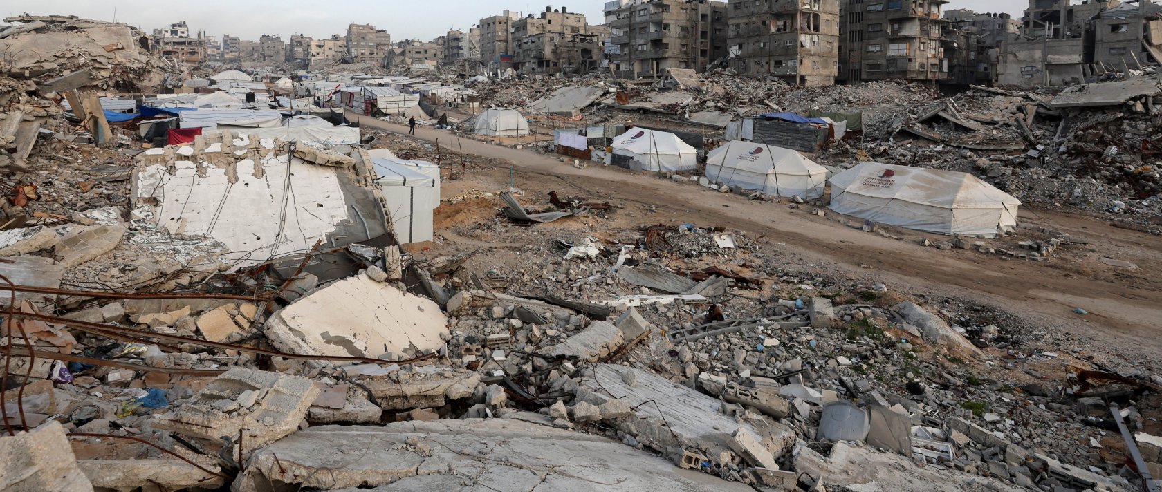 A tent camp, where displaced Palestinians take shelter, stands amidst the rubble of buildings destroyed in Israeli strikes during the war, Gaza City, Palestine, Jan. 27, 2026. (Reuters Photo)