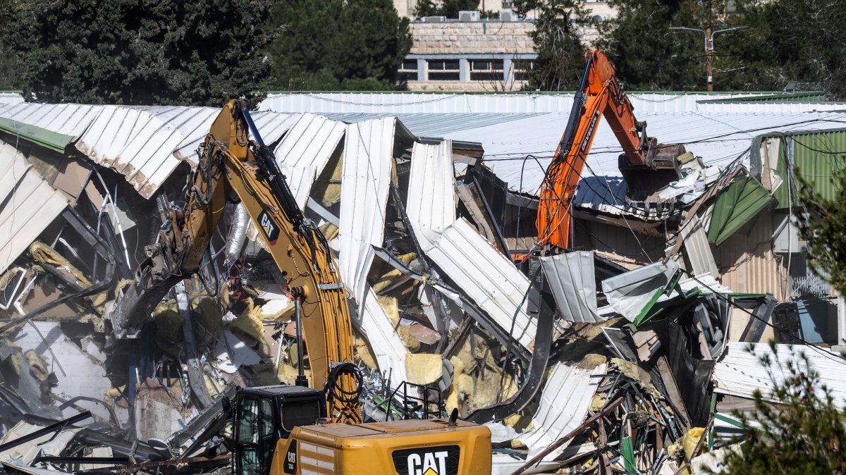 Israeli bulldozers demolish parts of the headquarters of the United Nations Relief and Works Agency (UNRWA) in the east Jerusalem neighborhood of Sheikh Jarrah, Jan. 20, 2026.  (EPA Photo)