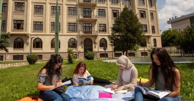 International students study together at a university campus, Istanbul, Türkiye, July 25, 2023. (Shutterstock Photo)