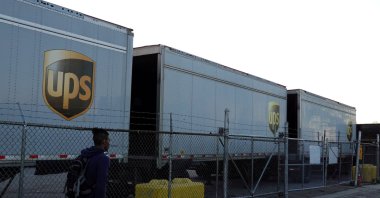 A person walks by United Parcel Service (UPS) trailers at a facility in Brooklyn, New York City, U.S., May 9, 2022. (Reuters Photo)
