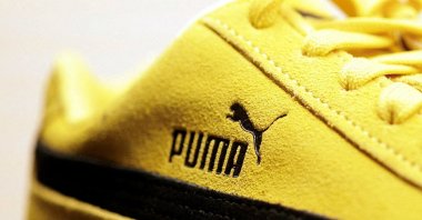 A Puma logo is seen on a Puma Speedcat OG sneaker displayed at the Puma Mostro House, Paris, France, Jan. 24, 2025. (Reuters Photo)