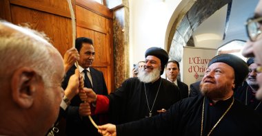 (L-R) Minister of Culture, Tourism and Antiquities Ahmed Fakkak Al-Badrani, Governor of Nineveh Abdul-Qader Al-Dakhil, Patriarch Mor Ignatius Aphrem II of the Syriac Orthodox Church, and Syriac Orthodox Archbishop Mor Nicodemus Daoud Sharaf ring the bell of St. Thomas Syriac Orthodox Church during the reopening ceremony following its reconstruction, San Jose, U.S., Oct. 15, 2025. (Getty Images Photo)