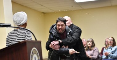 A man is tackled after spraying an unknown substance at U.S. Representative Ilhan Omar (L) during a town hall she was hosting in Minneapolis, Minnesota, U.S., Jan. 27, 2026. (AFP Photo)