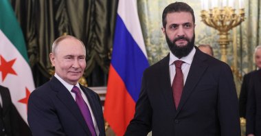 Russian President Vladimir Putin and Syrian President Ahmed al-Sharaa shake hands during a meeting at the Kremlin in Moscow, Jan. 28, 2026. (AFP Photo)