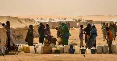 Sudanese displaced from el-Fasher, Darfur and Kordofan regions wait to receive water at the al-Affad displacement camp in al-Dabba city, Northern State, Sudan, Jan. 13, 2026. (AA Photo)
