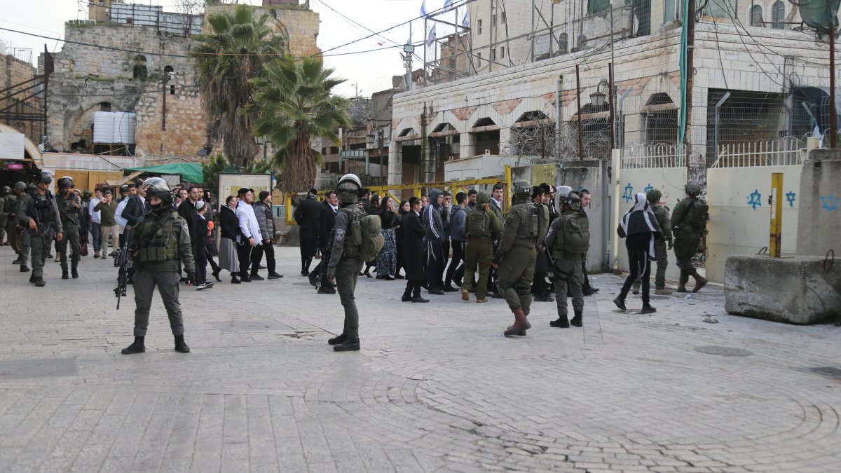 Israeli forces raid homes in West Bank town under siege