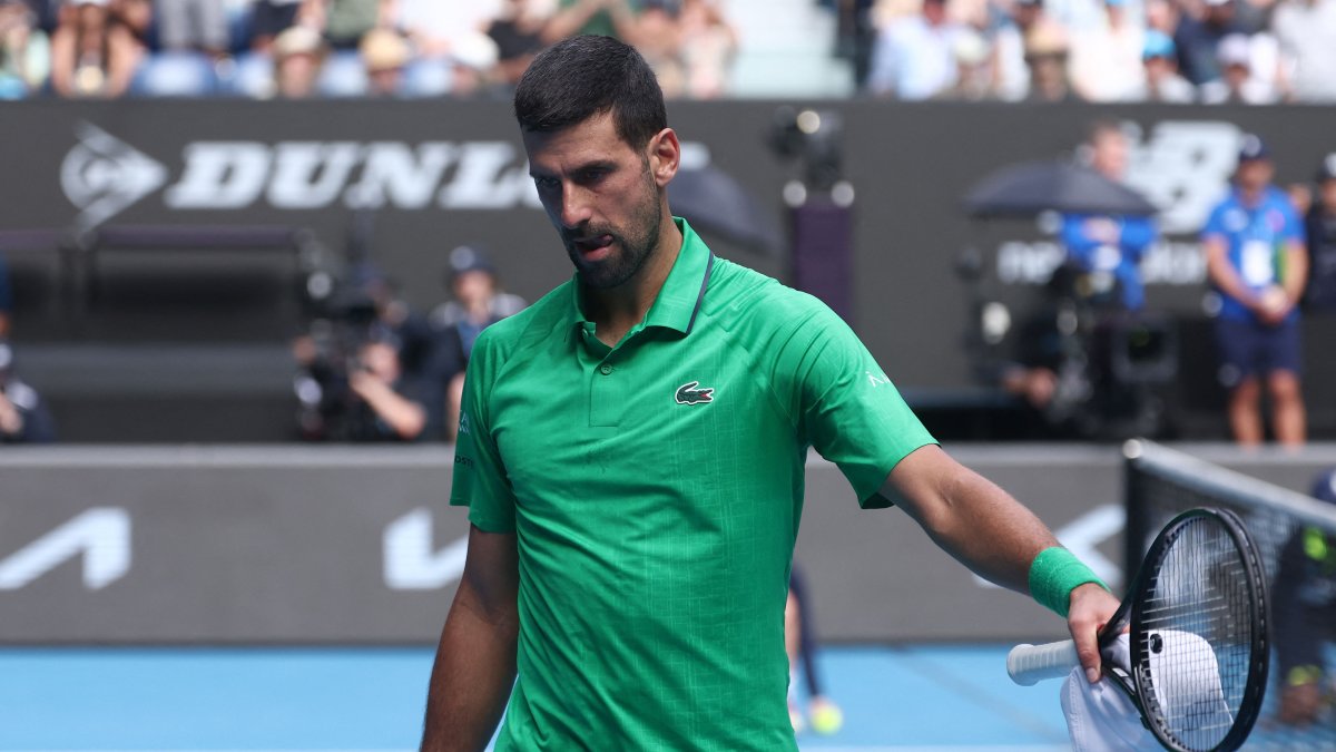 Serbia’s Novak Djokovic reacts after Italy’s Lorenzo Musetti retired injured during their men’s singles quarter-final match on day eleven of the Australian Open tennis tournament, Melbourne, Australia, Jan. 28, 2026. (AFP Photo)