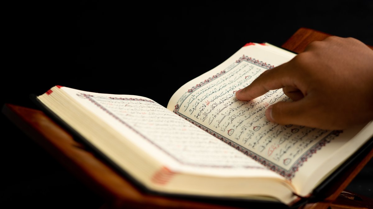 A person reads the Quran. (Shutterstock Photo)