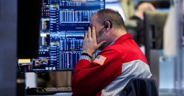 A trader works on the floor at the New York Stock Exchange (NYSE), New York City, U.S., Jan. 13, 2026. (Reuters Photo)