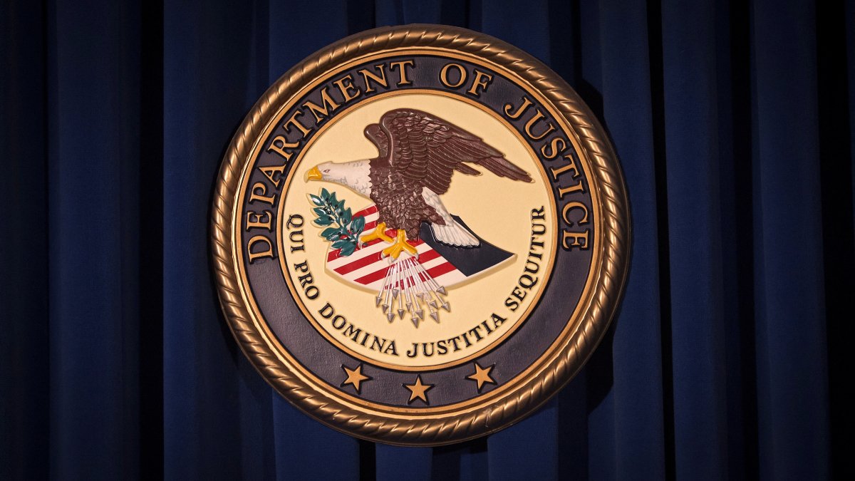 The Department of Justice logo is pictured on a wall after a news conference in New York, Dec. 5, 2013.  (Reuters File Photo)