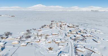 A village in Ahlat is seen covered with snow, Bitlis, Türkiye, Jan. 21, 2026. (AA Photo)