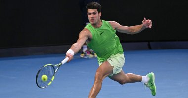 Spain's Carlos Alcaraz hits a return against Germany's Alexander Zverev during their men's singles semifinal match on day thirteen of the Australian Open tennis tournament, Melbourne, Australia, Jan. 30, 2026. (AFP Photo)