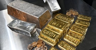 An employee shows a silver bar, as gold and silver bars of various values are stored in a safe deposit room in Munich, Germany, Jan. 28, 2026. (Reuters Photo)
