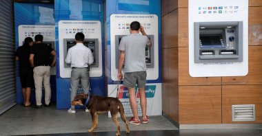 People withdraw money from ATM machines at the main shopping and pedestrian street of Istiklal, Istanbul, Türkiye, July 25, 2020. (Reuters Photo)