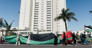 Pro-Palestinian activists display a big Palestinian flag during a march against Israel's attacks, in Durban, Oct. 5, 2024. (AFP Photo)