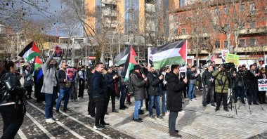 Protesters carry banners and Palestinian flags in Tirana, Albania, Jan. 30, 2026. (AA Photo)