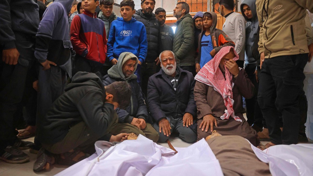 Mourners weep next to the bodies of Palestinians, who were reportedly killed by an Israeli air strike, in Khan Yunis, southern Gaza Strip, Jan. 31, 2026. (AFP Photo)