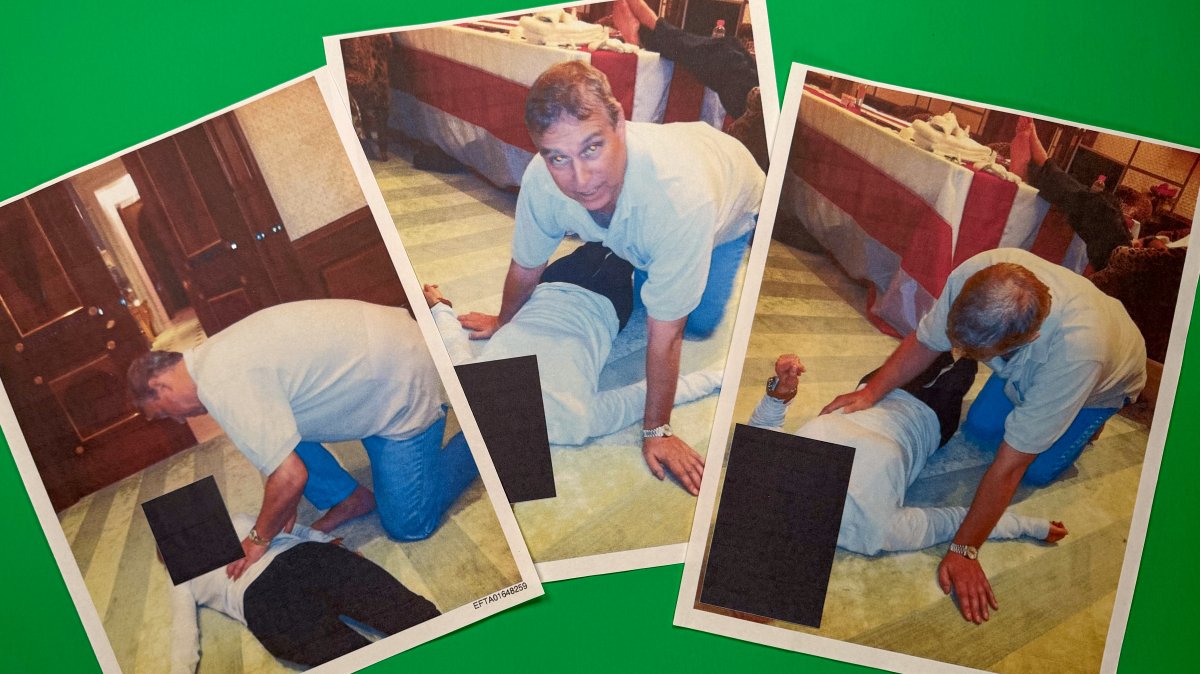 Images from an undated and redacted document released by the U.S. Department of Justice, photographed Saturday, Jan. 31, 2026, show Andrew Mountbatten-Windsor, formerly known as Prince Andrew, leaning over an unidentified person. (AP Photo)
