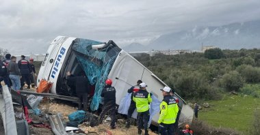 The wreckage of a passenger bus that overturned into a ravine, Antalya, Türkiye, Feb. 1, 2026. (AA Photo)