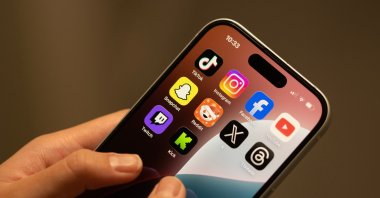 Famous social media apps displayed on a phone screen. (Shutterstock Photo)