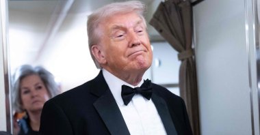 U.S. President Donald Trump speaks to members of the media aboard Air Force One as he travels from Washington to West Palm Beach, Florida, U.S., Jan. 31, 2026. (AFP Photo)
