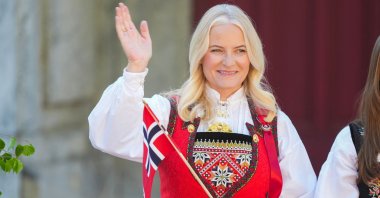 Crown Princess Mette-Marit greets the children's parade during the May 17 celebrations at the Royal residence, Skaugum, west of the capital Oslo, Norway, May 17, 2024. (AFP Photo)