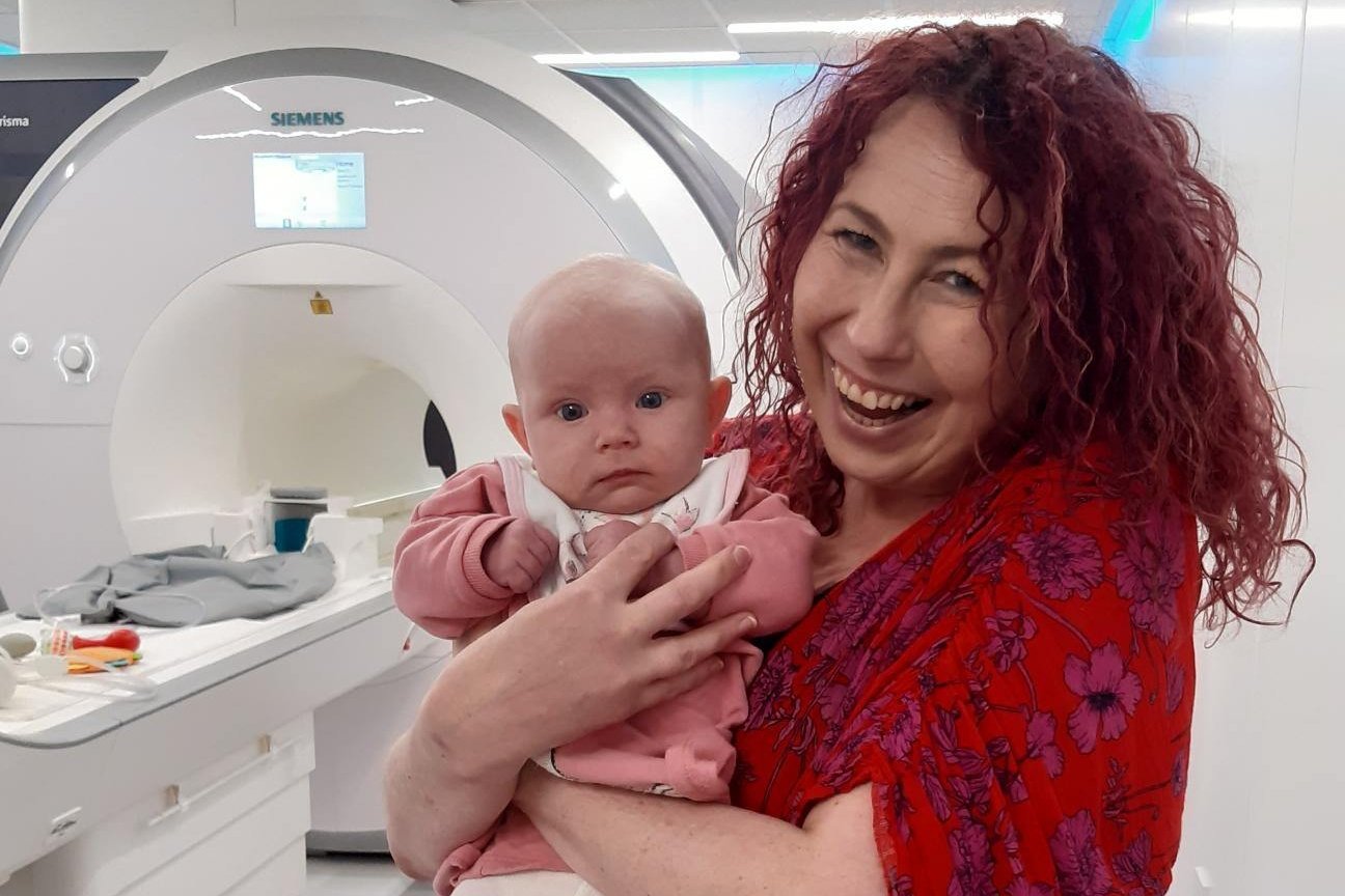 In this undated photo, baby Blaise attends her 2-month Foundcog scan with her mother Mary at Trinity College Institute of Neuroscience in Dublin, Ireland. (AP Photo)