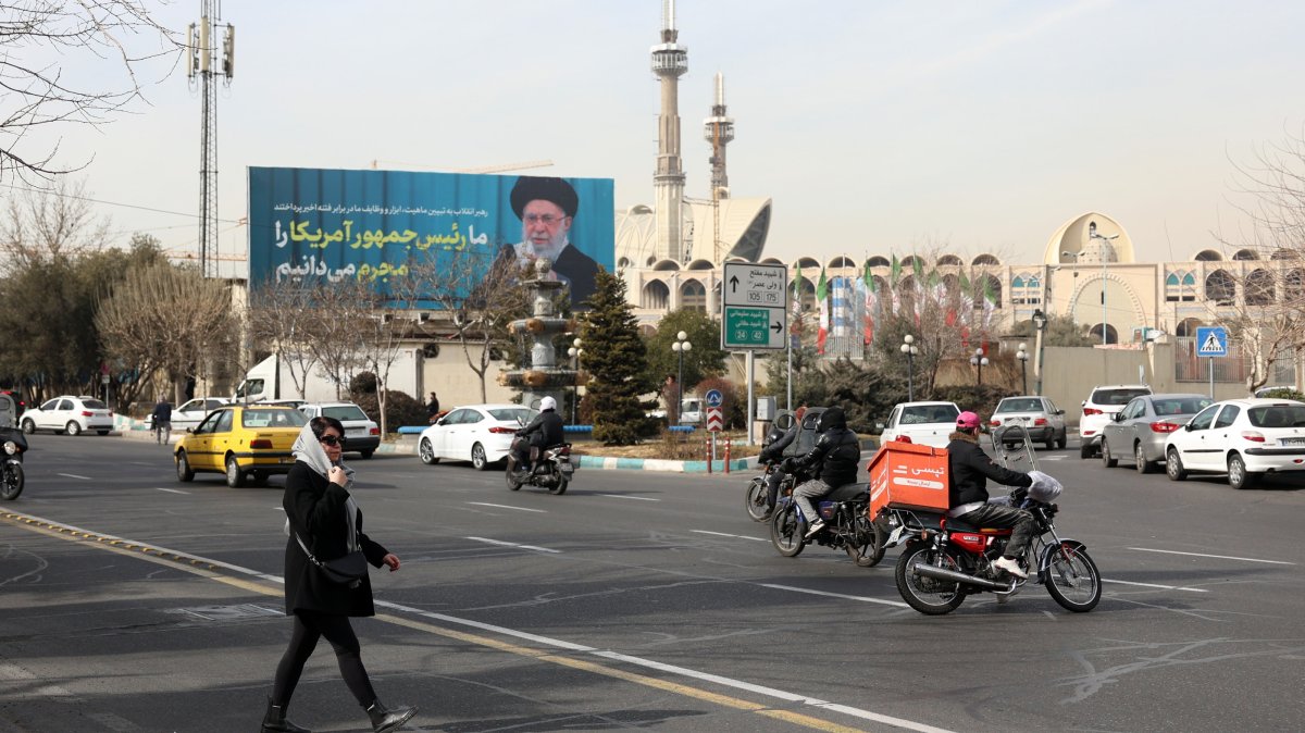 Iranians walk past next to a picture of Iranian supreme leader Ayatollah Ali Khamenei in a street, Tehran, Iran, Feb. 2, 2026. (EPA Photo)