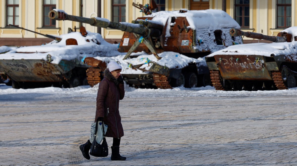 A resident walks past an exhibition of destroyed Russian military vehicles covered with snow during cold weather and often power and heating outages after critical civilian infrastructure was hit by recent Russian missile and drone strikes, amid Russia's attack on Ukraine, in Kyiv region, Ukraine, Feb. 2, 2026. (Reuters Photo)