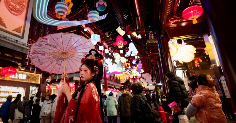 A visitor in traditional costume from the Ming Dynasty poses in Yu Garden (Yuyuan), decorated with lanterns and horse ornaments, for the upcoming Chinese New Year, Shanghai, China, Jan. 28, 2026. (EPA Photo)