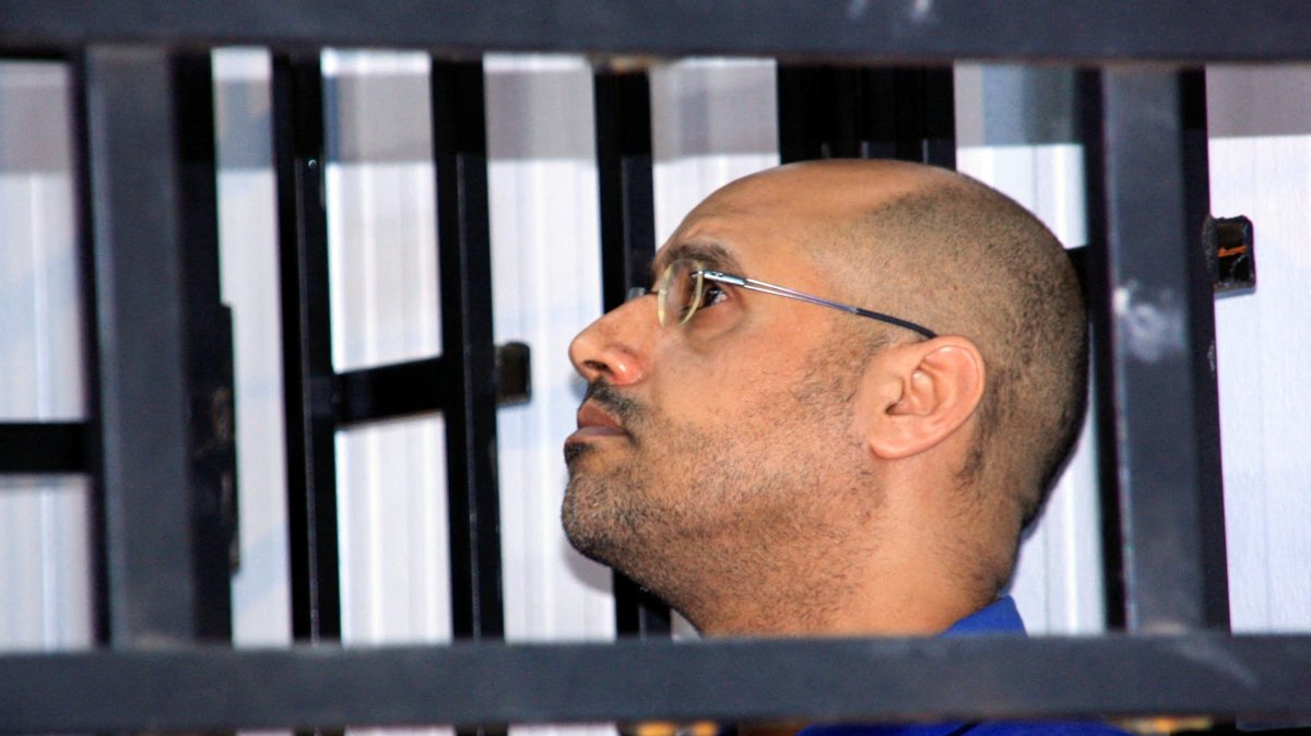 Saif al-Islam Gadhafi, son of late Libyan leader Moammar Gadhafi, attends a hearing behind bars in a courtroom in Zintan, May 25, 2014. (Reuters File Photo)