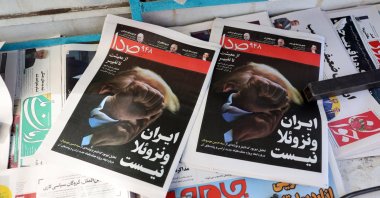 Copies of the Iranian daily newspaper Seda carrying a picture of U.S. President Donald Trump and a sentence reading in Persian "Iran is not Venezuela," Tehran, Iran, Jan. 31, 2026. (EPA Photo)