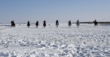 People on horseback playing the traditional equestrian sport of cirit in Kars, eastern Türkiye, Jan. 29, 2025. (AA Photo)