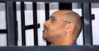Saif al-Islam Gadhafi, son of late Libyan leader Moammar Gadhafi, attends a hearing behind bars in a courtroom in Zintan, May 25, 2014. (Reuters File Photo)