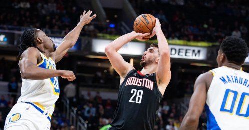 Houston Rockets' Alperen Şengün (C) shoots the ball while Indiana Pacers' Aaron Nesmith (L) defends in the first half at Gainbridge Fieldhouse, Indianapolis, U.S., Feb. 2, 2026. (Reuters Photo)