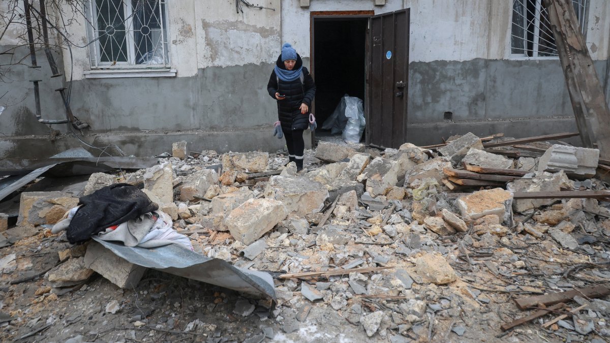 A resident leaves the apartment building hit by a Russian drone strike, amid Russia's attack on Ukraine, in Odesa region, Ukraine, Feb. 4, 2026. (Reuters Photo)