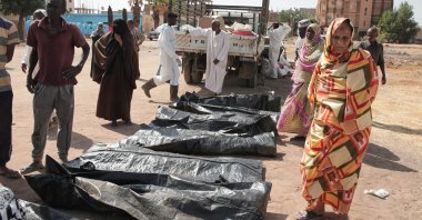 Relatives check the body bags of victims of Sudan’s two-year conflict after the Sudanese Red Crescent transferred the remains from makeshift graves to a local cemetery, Khartoum, Sudan, Jan. 11, 2026. (AP Photo)